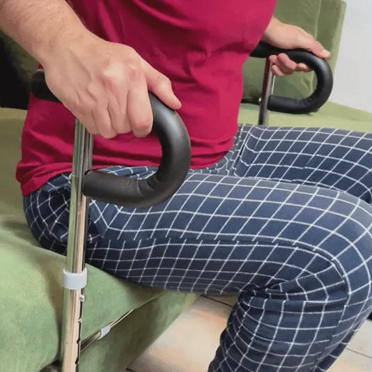 Real footage: a man pushes on the handles to stand up